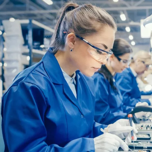 Electronics assembly workers in EGERIA-245 anti-static coats